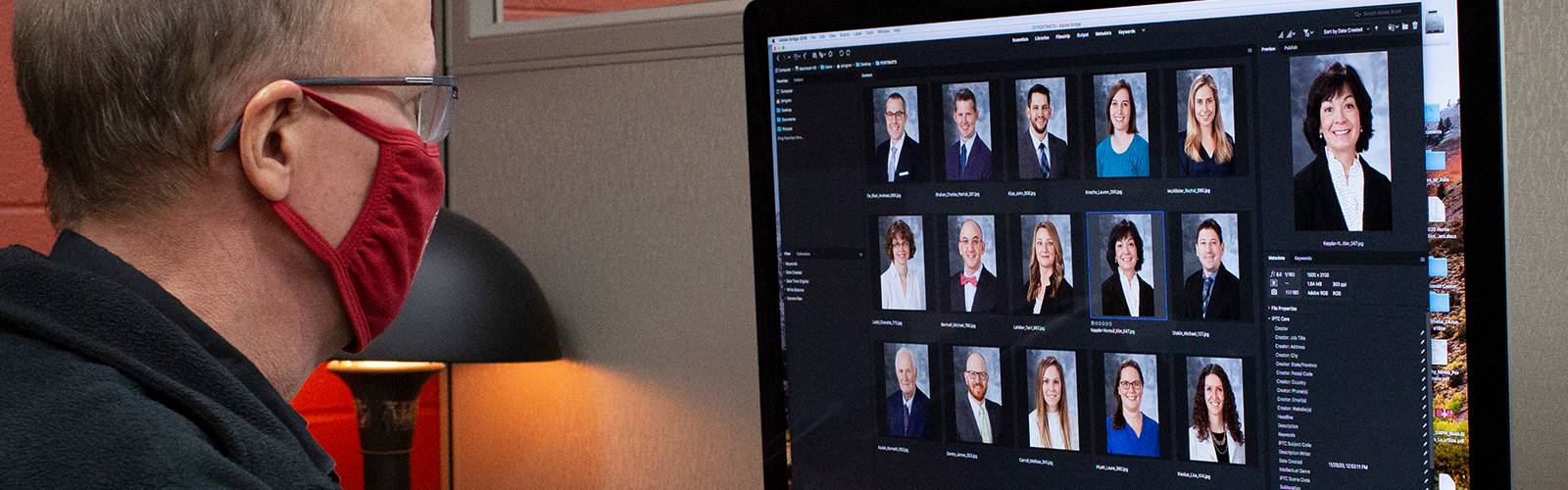 John Wingren at work in Media Solutions office Rm 1373, reviewign a recent Portraits photo shoot