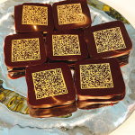 platter of chocolates with edible QR codes stamped on them