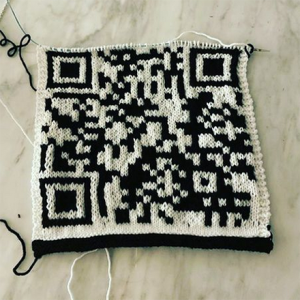 Aegeri Farbig's QR code knitted creation in black and white yarn